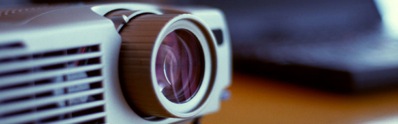 close-up image of the lense on a video projector