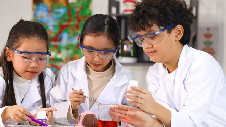 Young learners dressed as scientists.