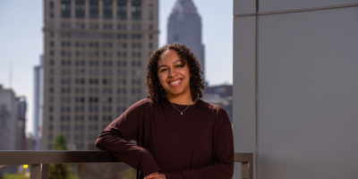 Leilah Flores posing in front of Cleveland skyline 