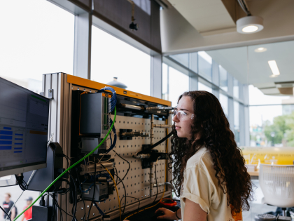 Female student with engineering equipment